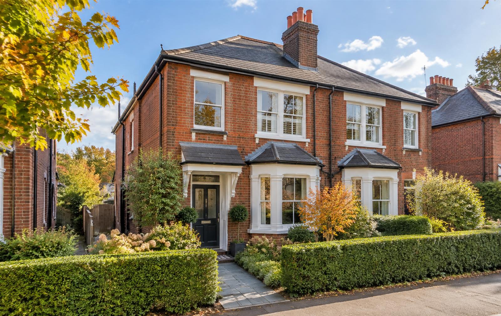 Illustrative red-brick Surrey investment home; not the actual clients' property